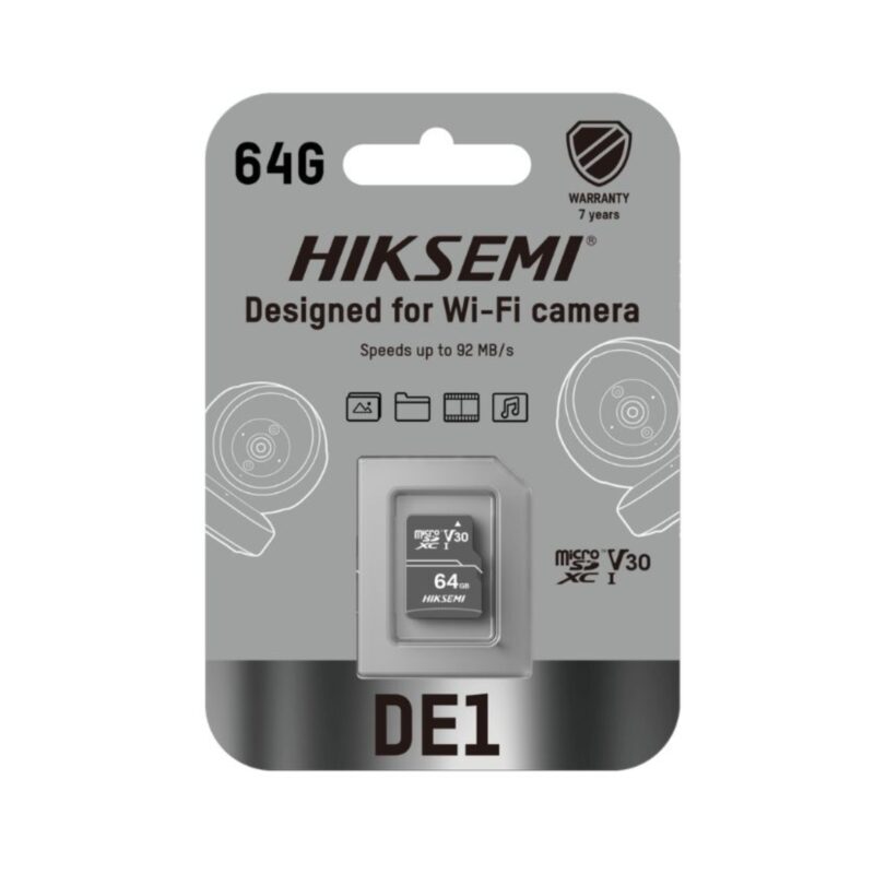 HIKSEMI DE1 64GB Class 10 V30 MicroSDXC memory card placed next to a smart home Wi-Fi security camera, highlighting continuous video storage.