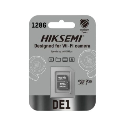 HIKSEMI DE1 128GB Class 10 V30 MicroSDXC memory card placed next to a smart home Wi-Fi security camera, highlighting continuous video storage.