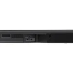 Sony HT-G700 3.1ch Dolby Atmos soundbar with wireless subwoofer positioned in front of a flat-screen TV in a home theater setting