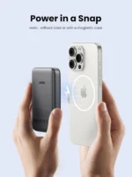 UGREEN PB561 10000mAh magnetic wireless power bank in Space Gray magnetically attached to the back of an iPhone charging wirelessly.