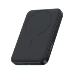 Baseus EnerFill FM11 10000mAh ultra-mini magnetic power bank snapped onto the back of a smartphone, showing its compact size and wireless charging capability.