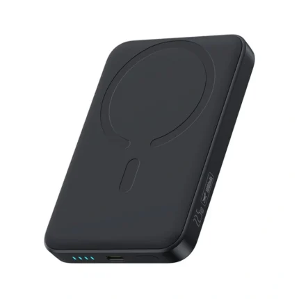 Baseus EnerFill FM11 10000mAh ultra-mini magnetic power bank snapped onto the back of a smartphone, showing its compact size and wireless charging capability.