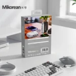 Mikorean 10000mAh mini pocket power bank with built-in dual charging cables, showing its ultra-compact design and LED battery display.