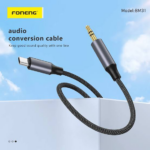 FONENG BM31 Type-C to 3.5mm metallic audio cable with braided cord connecting a Type-C smartphone to a 3.5mm headphone jack.